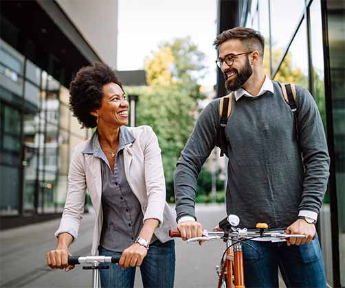 happy business people going to work bicycle